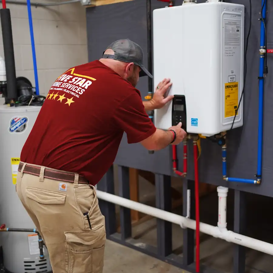 Plumber working on a tankless water heater