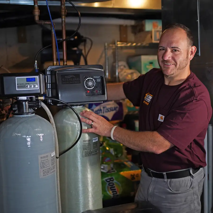 Plumber operating a water softener